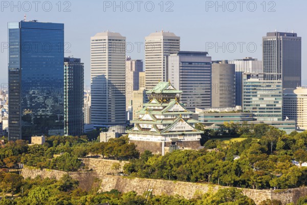 Osaka Castle from above with the skyline skyscrapers in Osaka, Japan, Asia