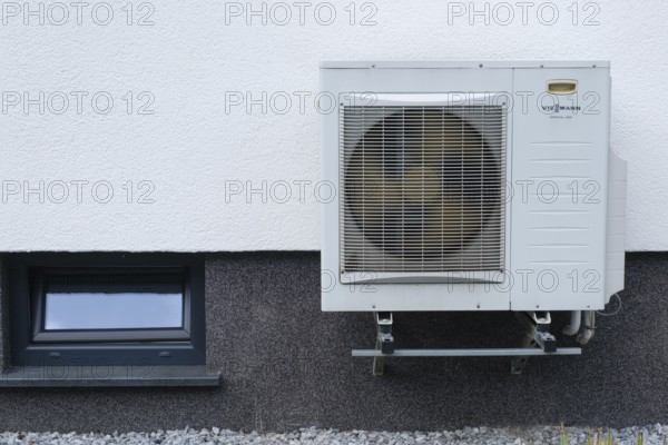 Heat pump on a house wall, North Rhine-Westphalia, Germany, Europe