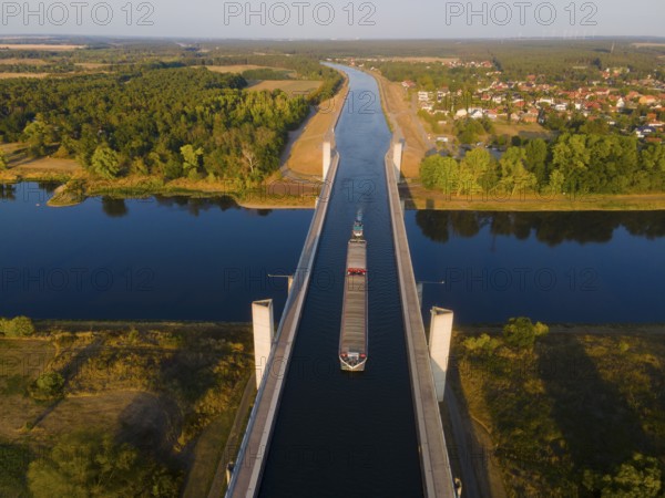 Drone shot, cargo ship on the Mittelland Canal, Magdeburg waterway junction, canal bridge,