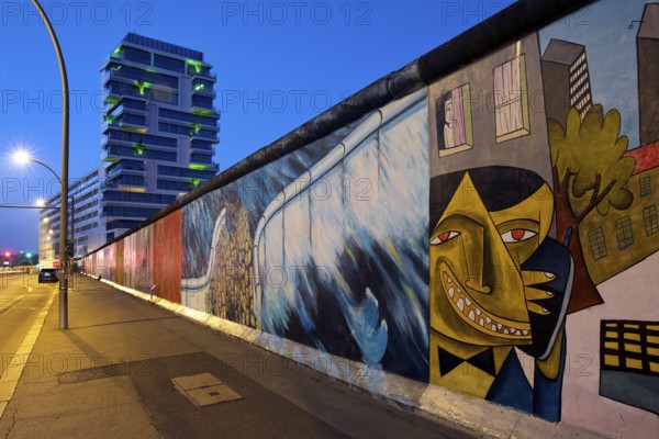 East Side Gallery in the early morning, mural by artist Jim Avignon and friends and Kani Alavi,