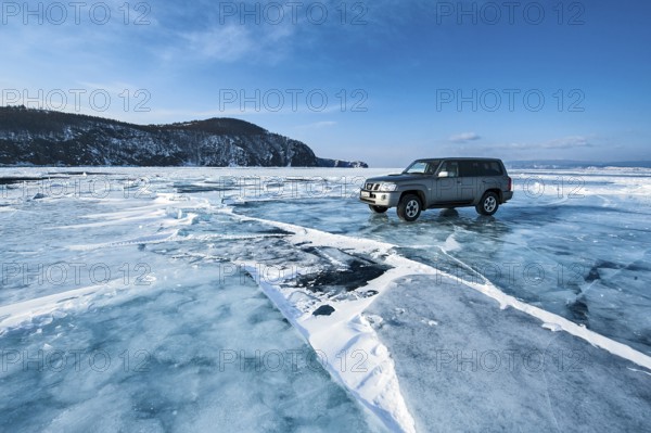 Car on ice, Lake Baikal, Olkhon Island, Pribaikalsky National Park, Irkutsk Province, Siberia,
