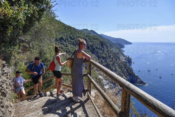 Hikers on the trail between Levanto and Monterosso, Cinque Terre, La Spezia Province, Liguria,