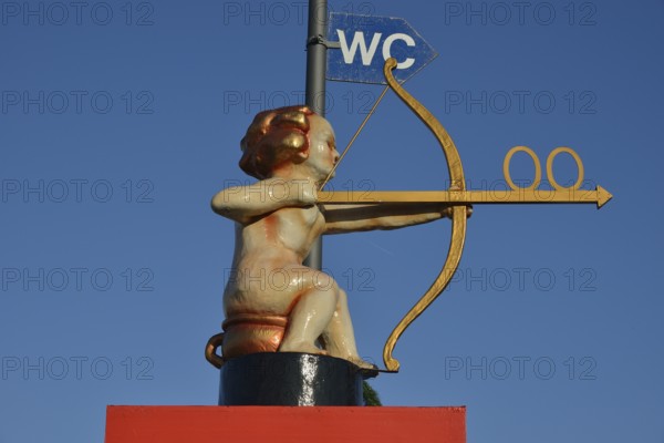 Archer Cupid as a toilet sign, Oktoberfest, Munich, Upper Bavaria, Bavaria, Germany, Europe