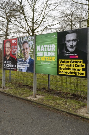 Board with election posters, SPD, CDU, Bündnis90 Die Grünen, FDP, Bundestag election 2025, Kamen,