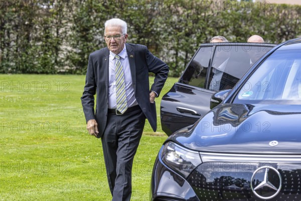 Winfried Kretschmann, Prime Minister, Green Party. Getting out of his official Mercedes car, in