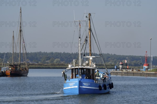 Fishing boat in the harbour entrance at the Peenestrom, Baltic resort Karlshagen, Island Usedom,
