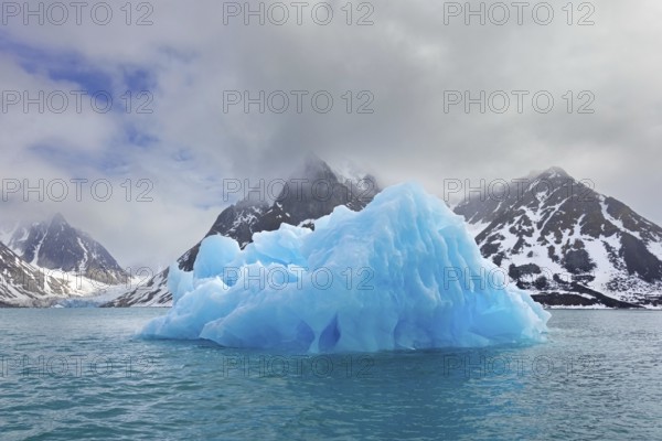 Iceberg melting in summer in Magdalenefjorden, fjord in Albert I Land on Svalbard, Spitsbergen,