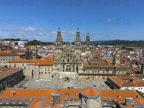 An impressive aerial view of a historic cathedral with red roofs on a sunny day, Cathedral,