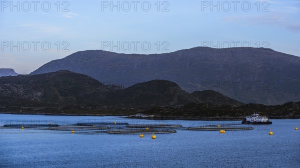 Sunset over Salmon farm in Norway, Innvikfjorden, Olden, Norway, Europe