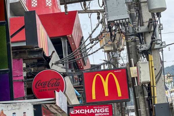 Coca Cola and McDonald's: American food companies are active worldwide. Logos of the brands on