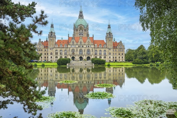 New town hall on Trammplatz with reflection in the Maschteich Hanover Germany