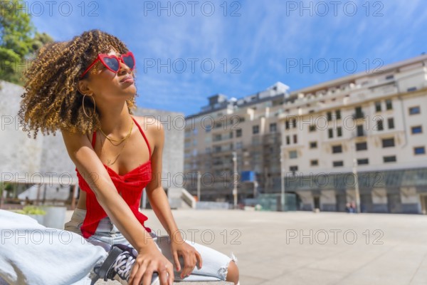 Horizontal photo with copy space of a latin young beauty female tourist enjoying sun sitting in the