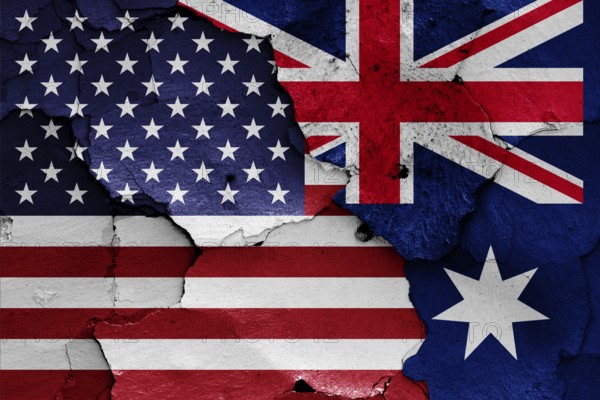 Flags of USA and Australia painted on cracked wall