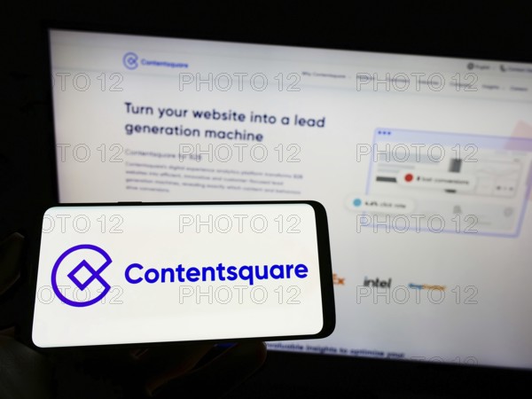 Stuttgart, Germany, 09-10-2022: Person holding mobile phone with logo of analytics platform company