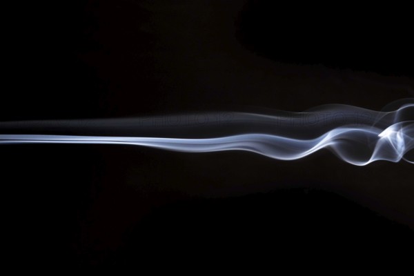 White smoky swirls abstract black background