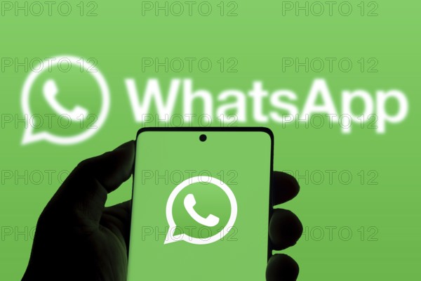 WhatsApp logo is displayed on smartphone.