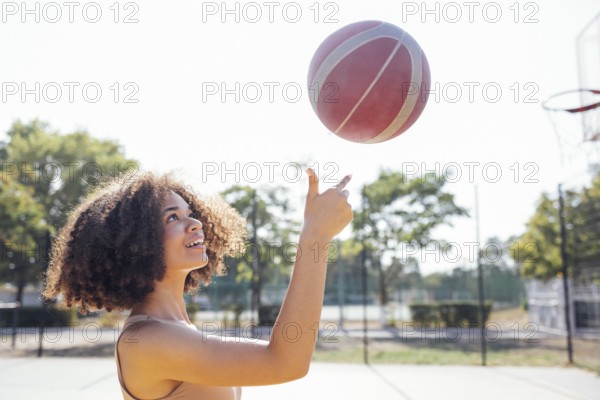 Mixed-race young smiling female outdoors and having fun. Stylish cool teen girl gathering at