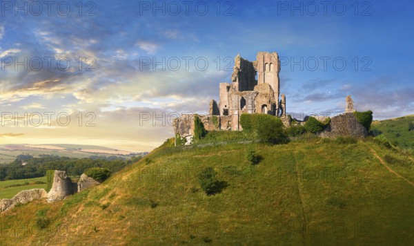 Medieval Corfe castle keep & battlements at sunrise, built in 1086 by William the Conqueror, Dorset