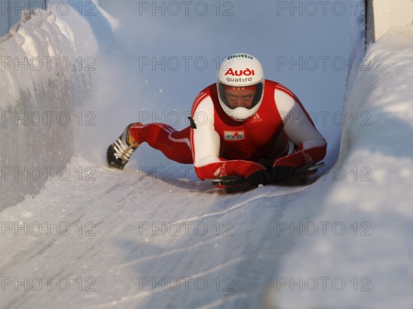 Man riding a skeleton sled at the Innsbruck bobsleigh track, Igls Olympic Bobsled Run, Igls,