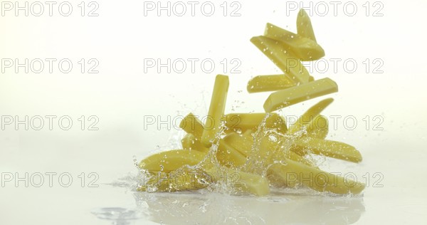 French Fries, Charlotte Potato (solanum tuberosum), Vegetable falling on Water against White