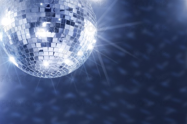 A Mirror disco ball hanging from the ceiling