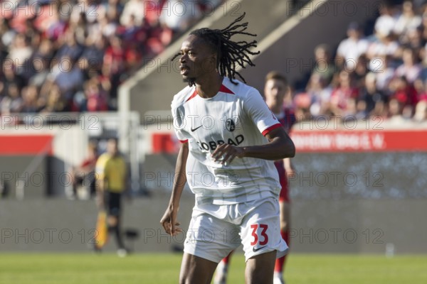 Football match, Jordy MAKENGO SC Freiburg attentively watching an action with view to the left,