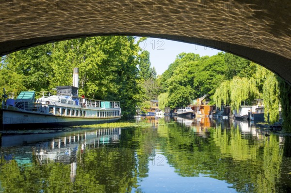 Berlin, Germany, June 2022: View on houseboat on the Spree river in Berlin in Tiergarten, Europe