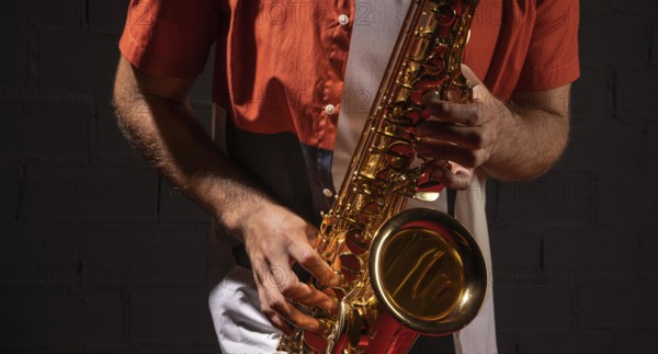 Front view man playing saxophone