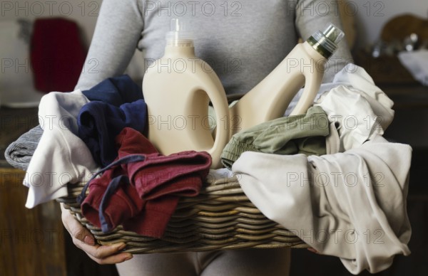Woman holding laundry basket close up. Resolution and high quality beautiful photo