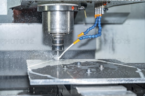Close-up of a cnc modern milling machine cutting a mould