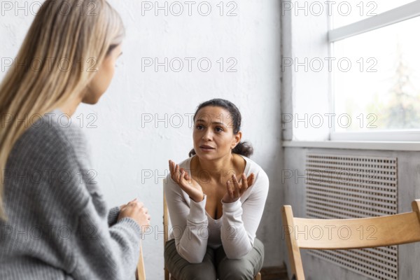 Woman talking about her problems group therapy session