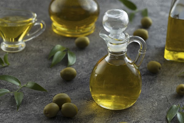 High view of bottles filled with olive oil on marble background Picture on pik. Resolution and high