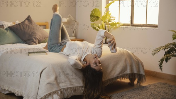 Woman using smartphone home bed. Resolution and high quality beautiful photo