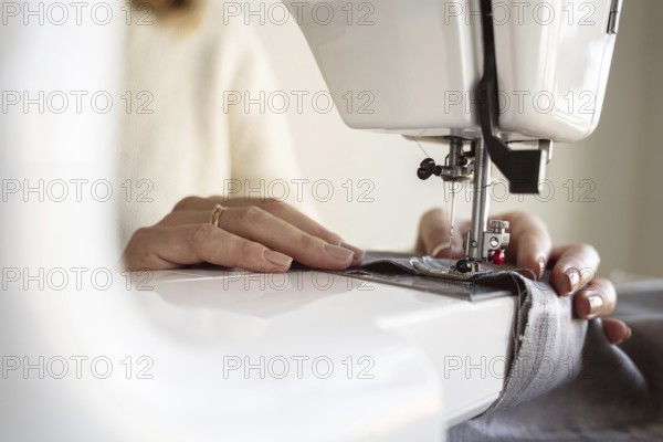 Close up person using sewing machine. Resolution and high quality beautiful photo