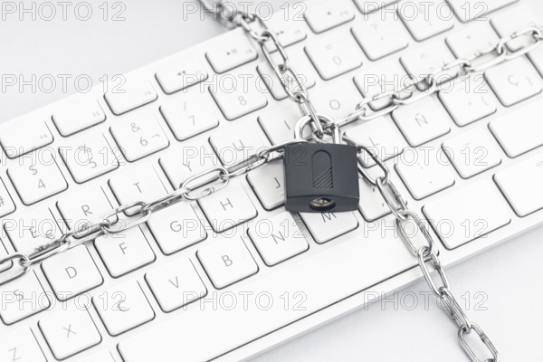 Computer Security concept. Chain and padlock on keyboard. Cyber security concept