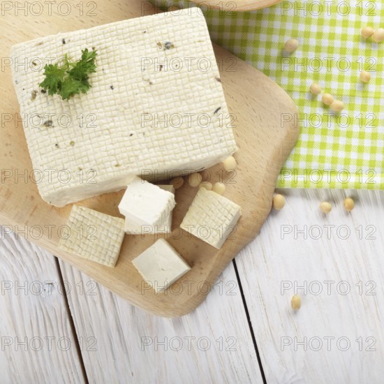 Flat lay view at Soy Bean curd tofu on cutting board Non-dairy alternative substitute for cheese
