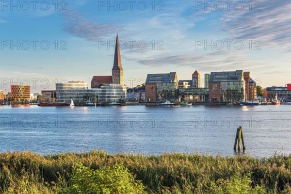 View across the Warnow to the Hanseatic city of Rostock in the evening