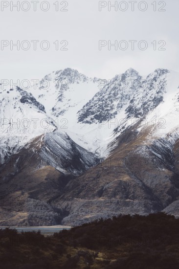 Snowy mountain landscape with clearly visible peaks under a cloudy sky, Hooker Valley Track, New