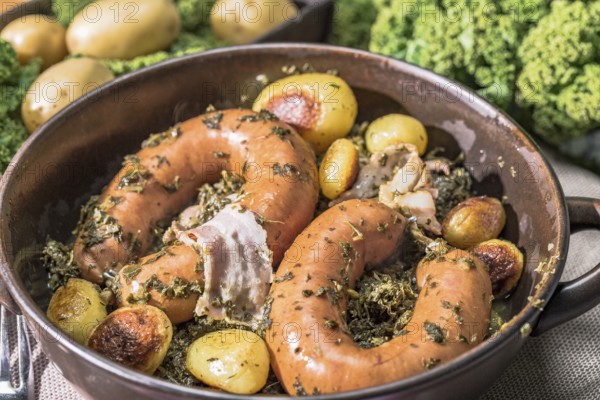 Kale with Bregenwurst sausage and roast potatoes