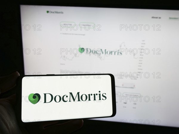 Stuttgart, Germany, 11-08-2023: Person holding mobile phone with logo of Swiss online pharmacy