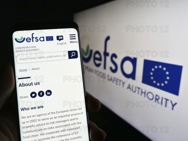 Stuttgart, Germany, 03-25-2023: Person holding mobile phone with website of EU agency European Food