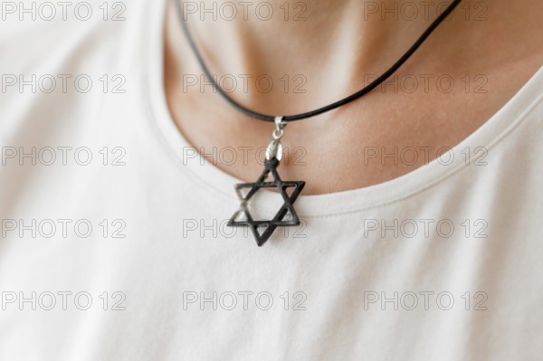 Front view person wearing david s star pendant