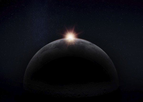 View of the dark hidden side of the Moon with the Sun behind it. Negative space for copy text.