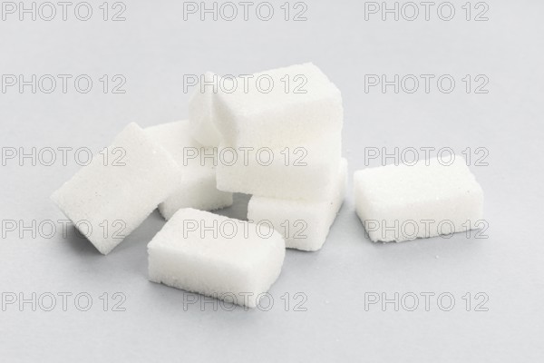 Sugar cubes on gray background. Close up