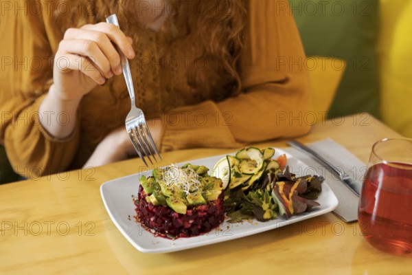 Close up hand holding fork