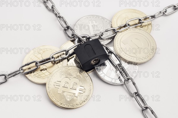 Cryptocurrency security concept. Group of crypto coin protected by chain and padlock