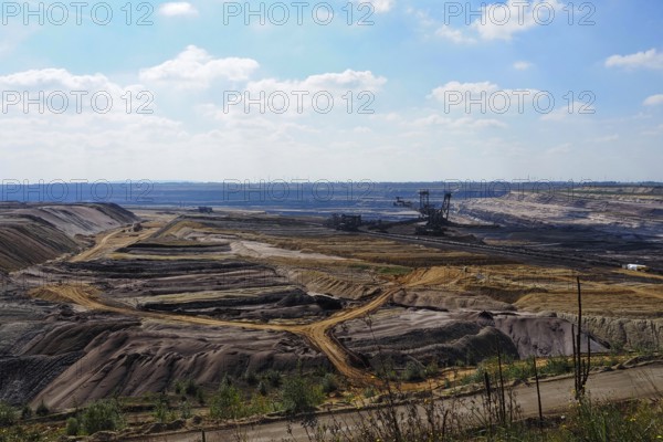 View over the Garzweiler open-cast lignite mine with large excavator, Rhenish lignite mining area,