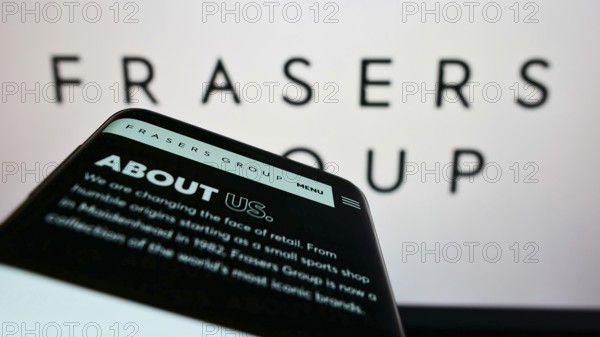 Stuttgart, Germany, 06-04-2022: Smartphone with website of British retail company Frasers Group plc