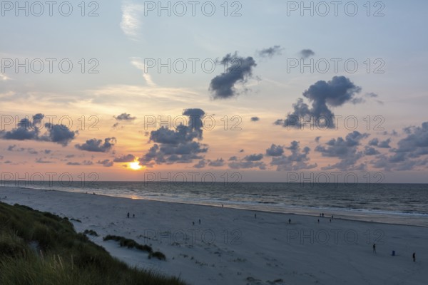 Sunset on a sandy beach with dunes, Buren, Ameland Island, Friesland, Netherlands