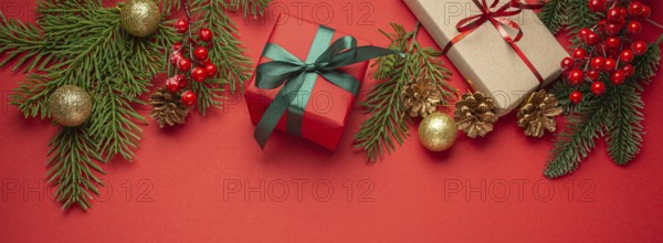 Christmas or New Year celebration red paper festive background with decoration fir tree, wrapped